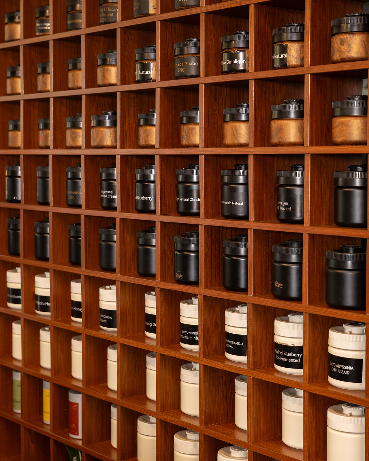 Tasting Room jar wall of named single-origin lots — the library we curate rarities from